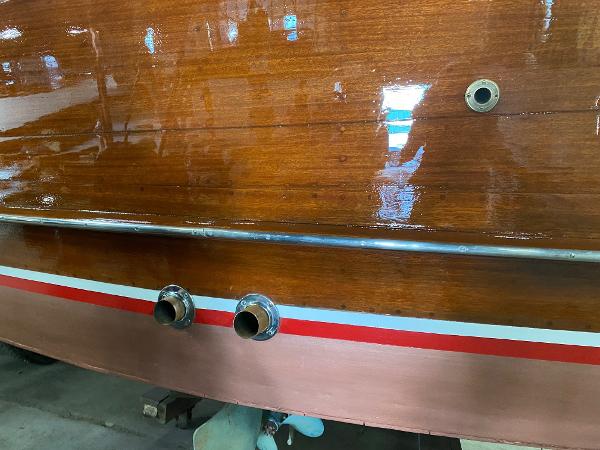 Slide: The Image of 1959 Chris-Craft Sportsman boat with polished wooden hull and chrome fittings. - 17