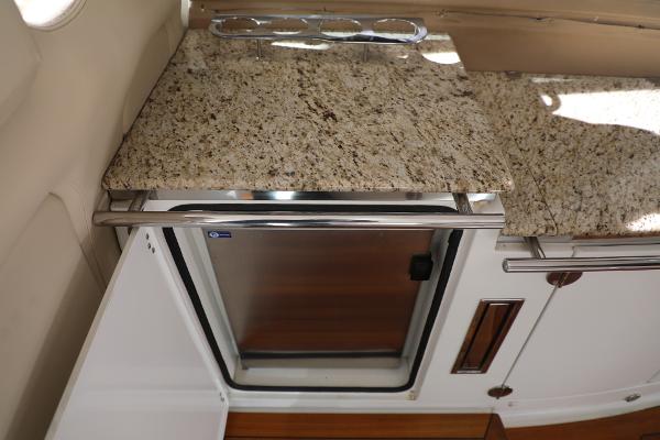 Slide: The Image of 2008 Cobalt 46 yacht kitchen with granite countertop and stainless steel mini-fridge. - 7