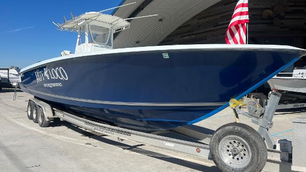 Slide: The Image of 2005 Contender 36 Open boat on a trailer with American flag. - 1