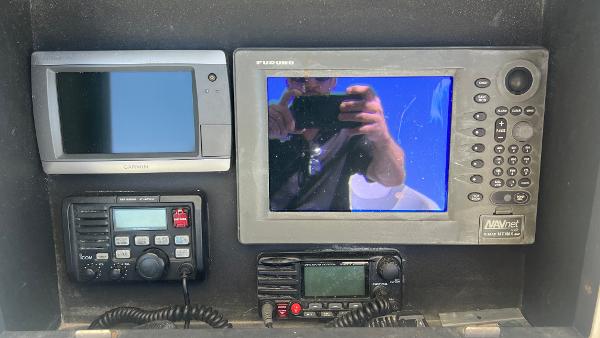 Slide: The Image of 2005 Contender 36 Open boat dashboard with navigation and communication equipment. - 10