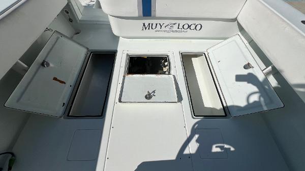 Slide: The Image of 2005 Contender 36 Open boat deck with open storage compartments. - 13