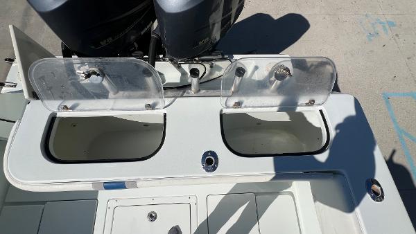 Slide: The Image of 2005 Contender 36 Open boat with dual livewells and twin outboard engines. - 14
