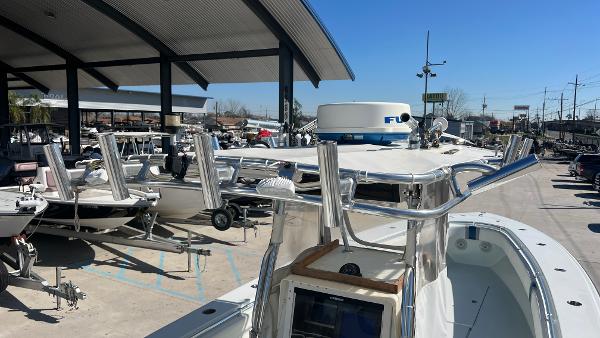 Slide: The Image of 2005 Contender 36 Open boat in a marina, surrounded by other boats. - 27