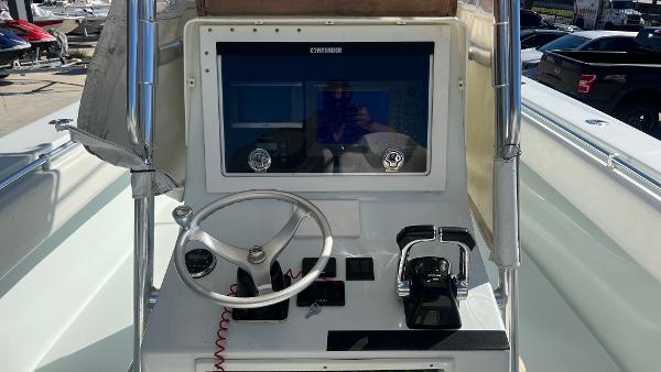Slide: The Image of 2005 Contender 36 Open boat helm with steering wheel and controls. - 8