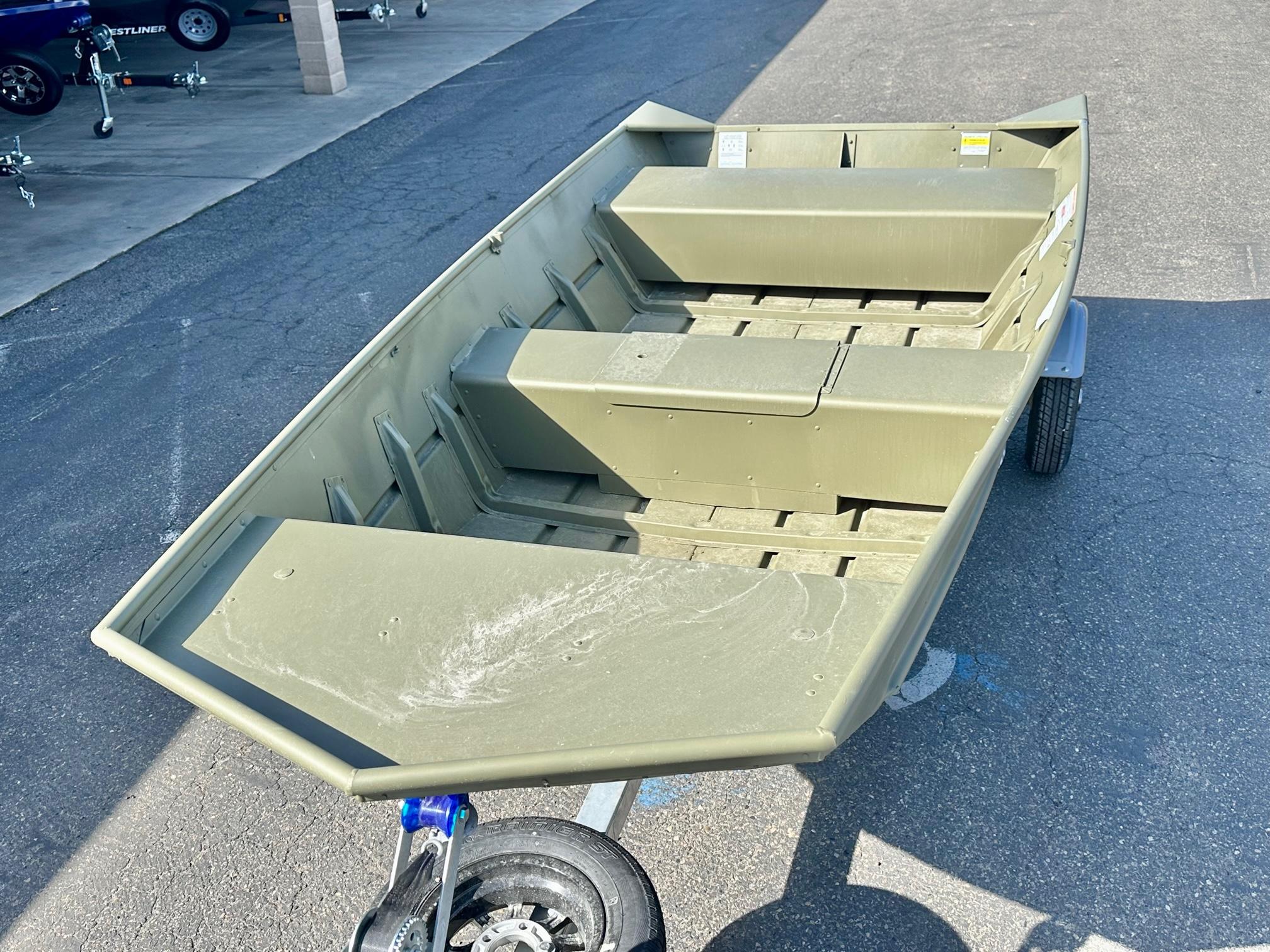 Slide: The Image of 2024 Crestliner 1448M aluminum boat on trailer, parked on pavement. - 3