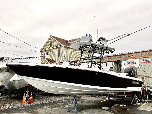 Slide: The Image of 2023 Crevalle 26 HBW boat on display at a marina. - 0
