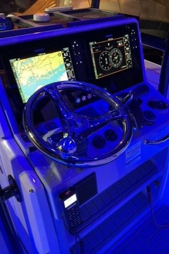 Slide: The Image of 2023 Crevalle 26 HBW boat dashboard with navigation and control systems. - 9