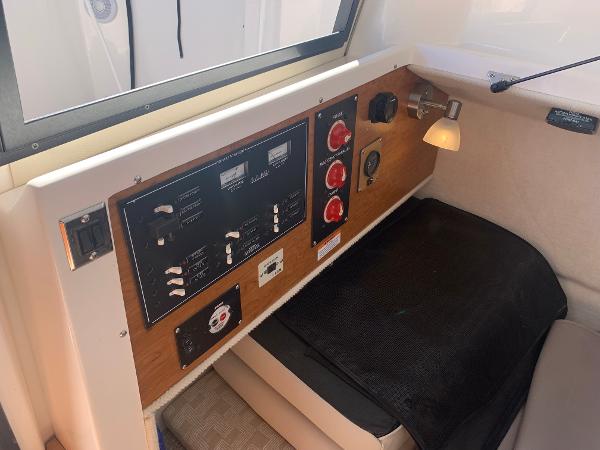 Slide: The Image of Control panel inside a 2022 Cutwater C-24 Coupe boat cabin. - 16