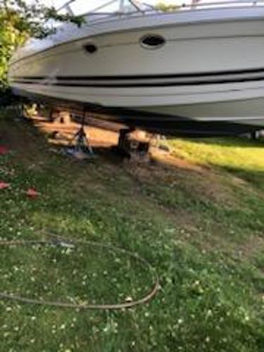 Slide: The Image of 2000 Formula 33SS boat on land, supported by stands. - 7