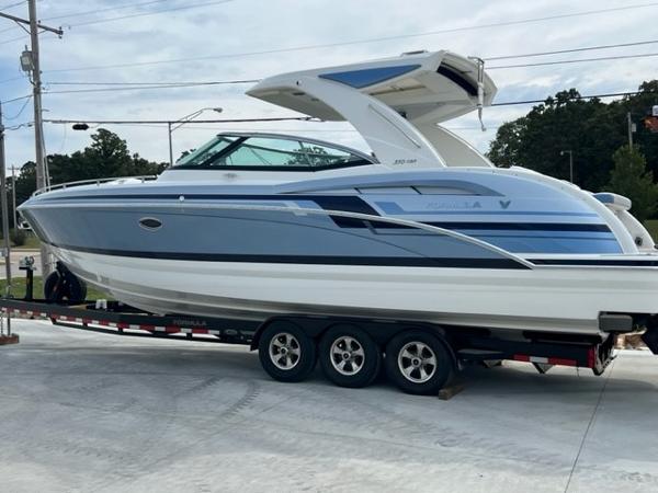 Slide: The Image of 2023 Formula 350 CBR boat on trailer, sleek design, blue and white color scheme. - 1