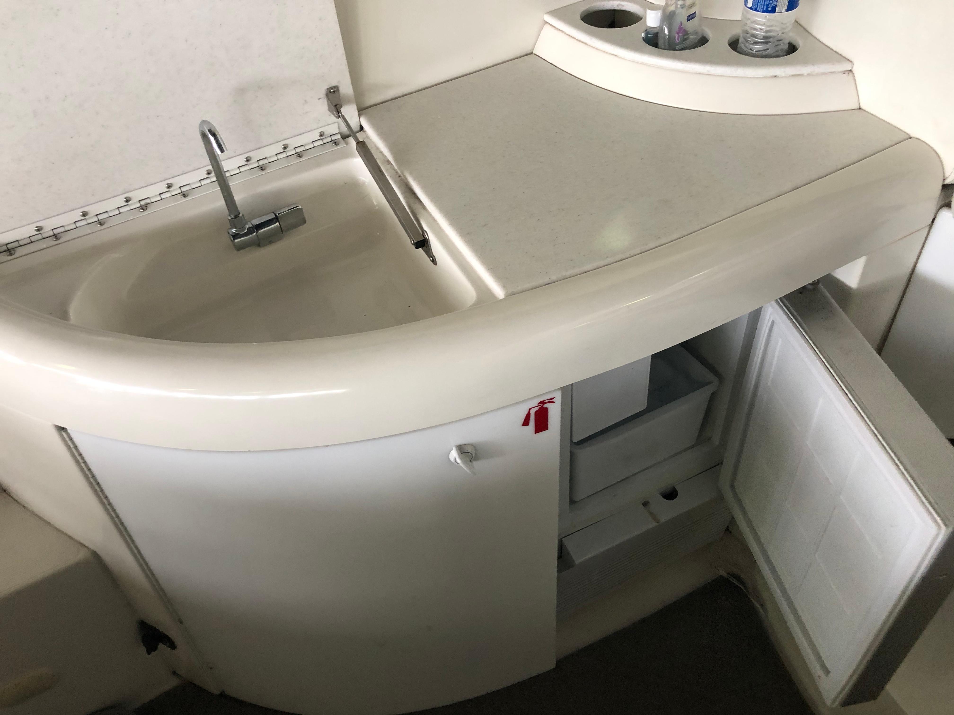 Slide: The Image of Small sink and countertop area in a 2000 Formula 37 PC boat. - 16