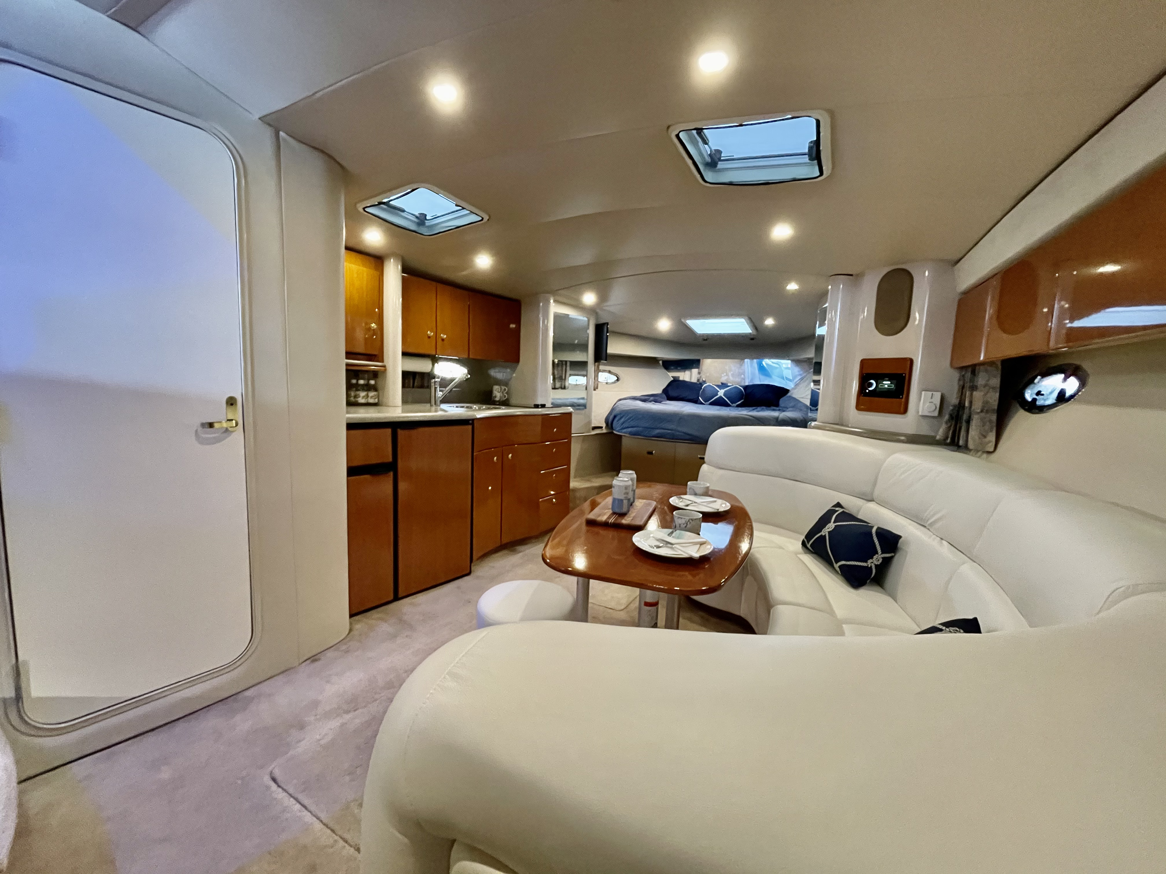 Slide: The Image of Interior of 2000 Formula 37 PC yacht with white leather seating and wooden cabinetry. - 19