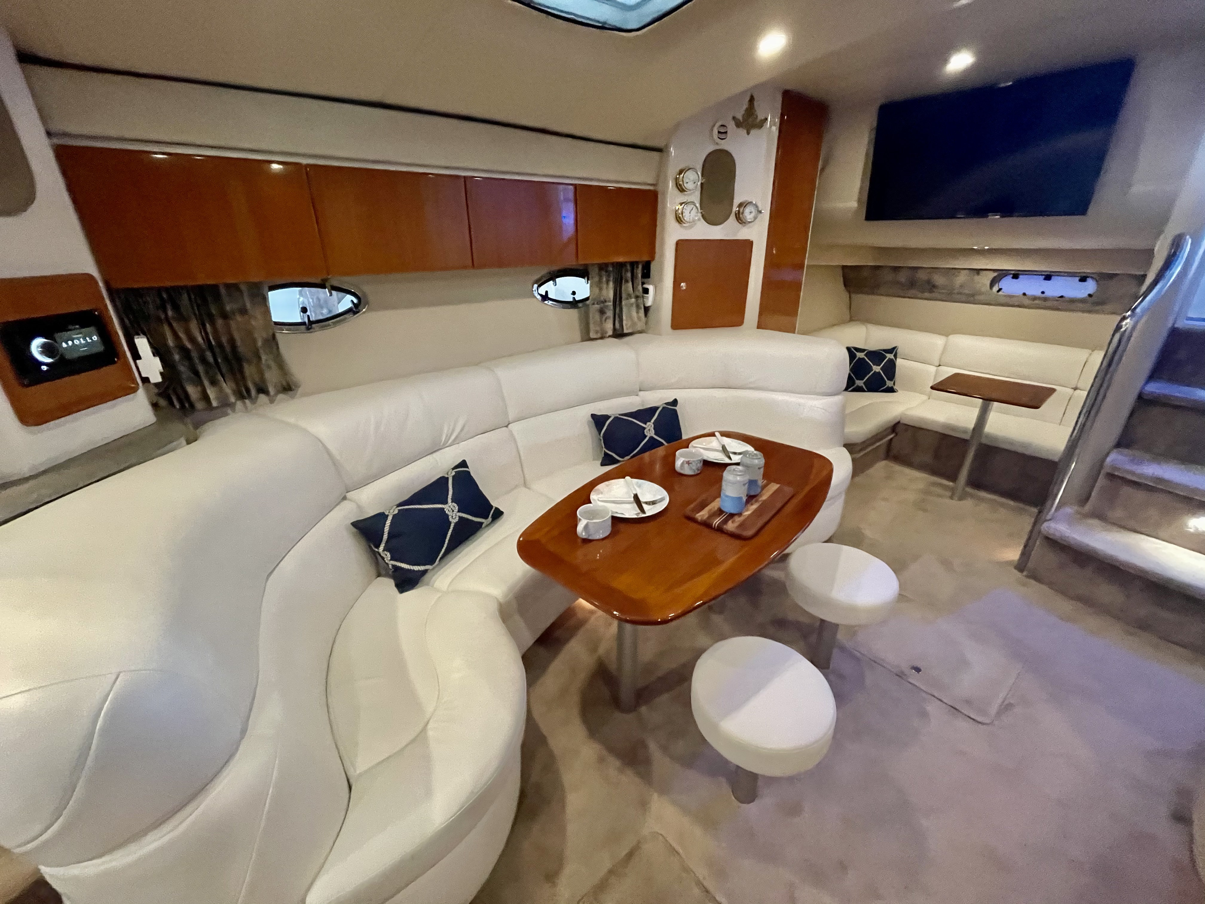 Slide: The Image of Luxurious interior of a 2000 Formula 37 PC yacht with white leather seating and wooden table. - 20