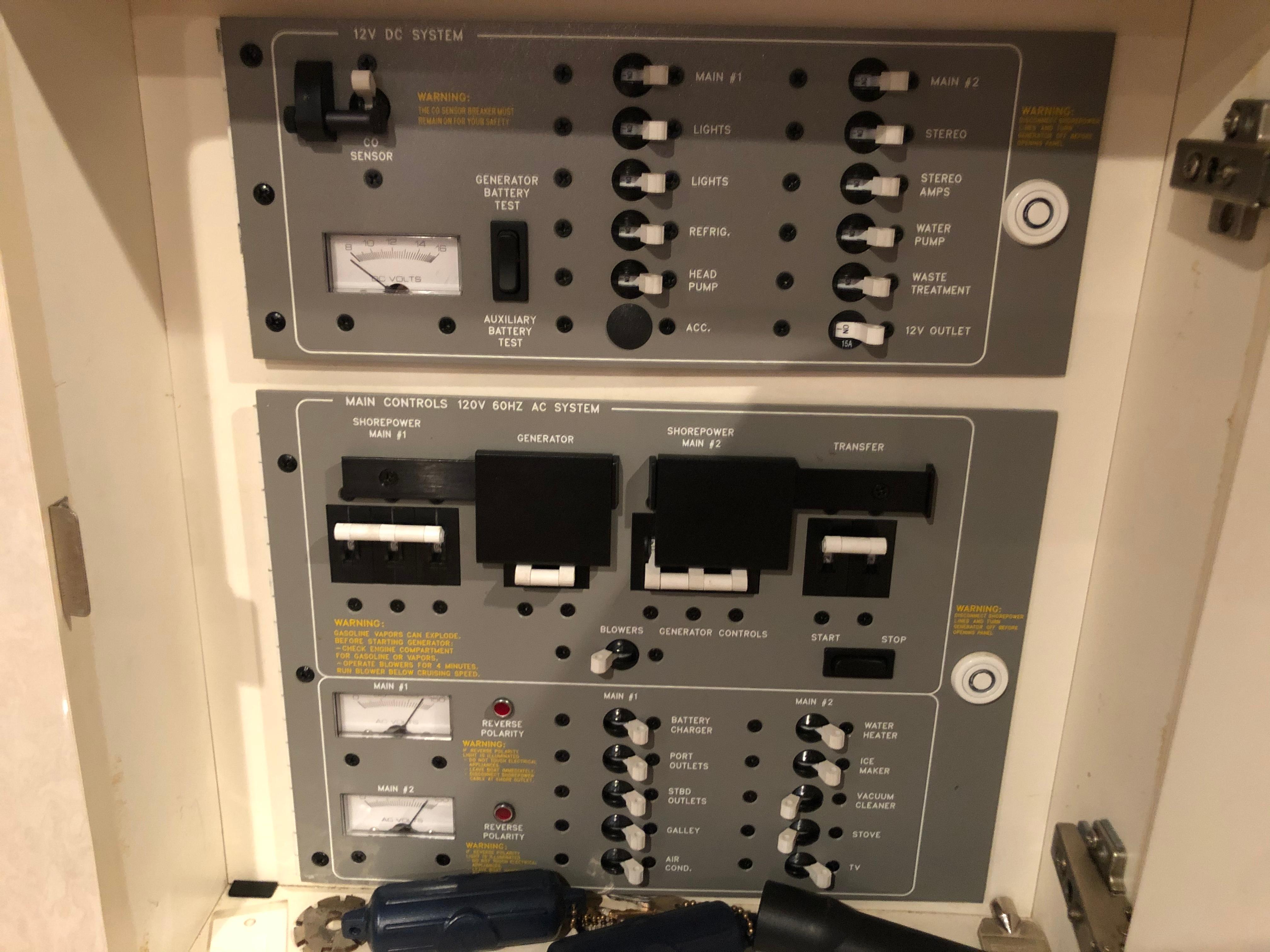Slide: The Image of Control panel of a 2000 Formula 37 PC boat showing 12V DC and 120V AC systems. - 31