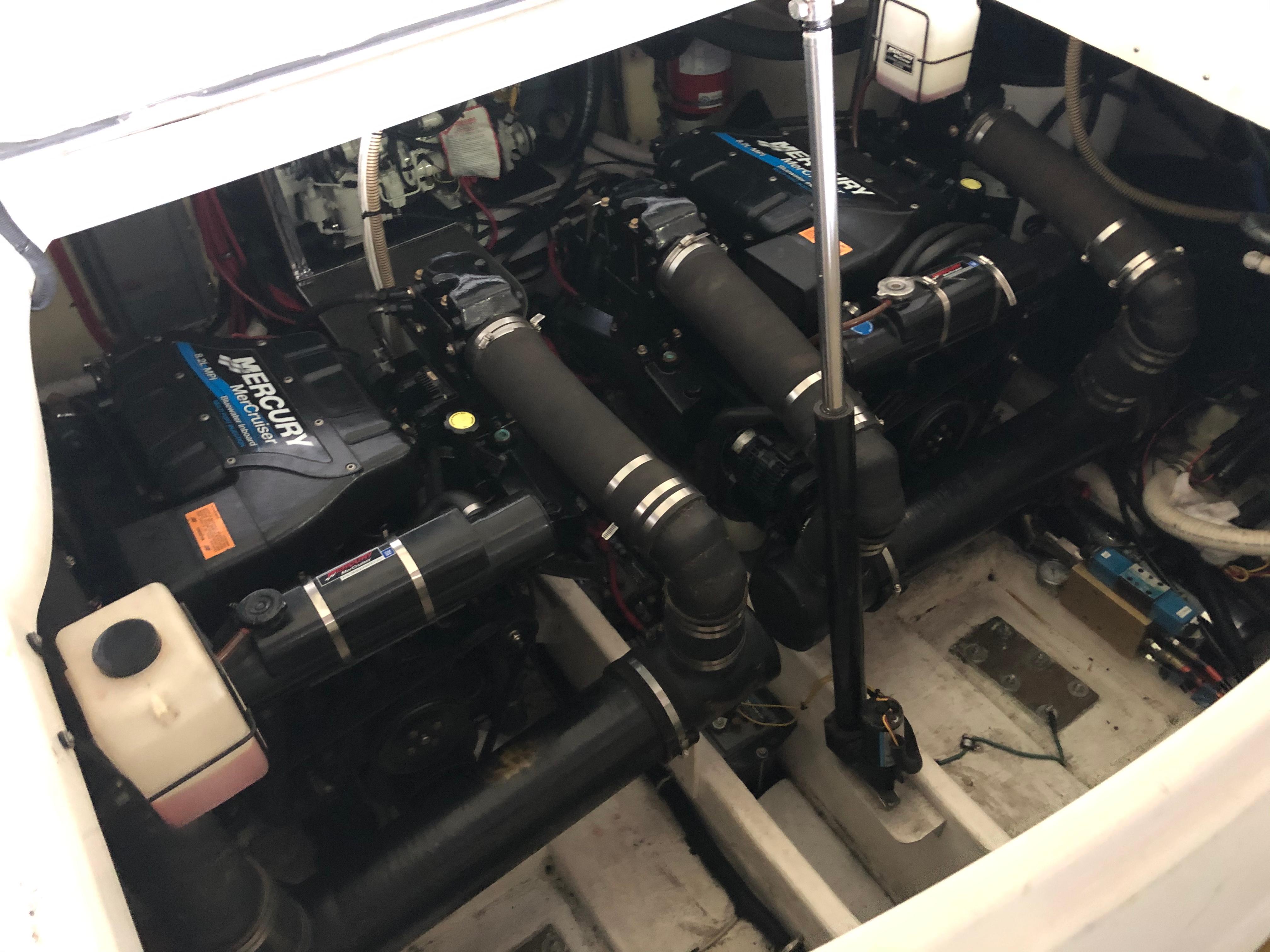 Slide: The Image of Engine compartment of a 2000 Formula 37 PC boat with twin Mercury engines. - 32
