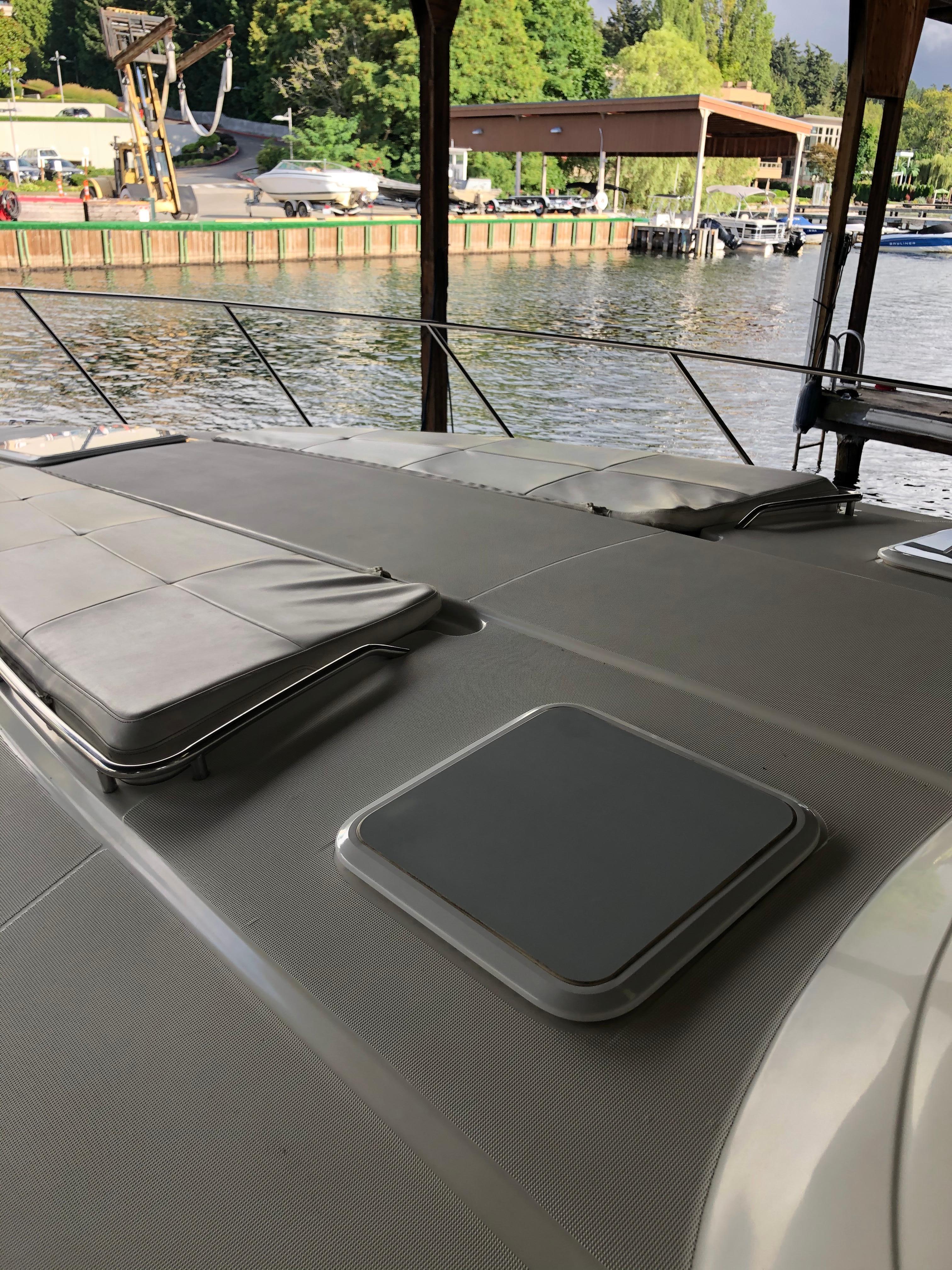 Slide: The Image of Top deck of a 2000 Formula 37 PC yacht docked at a marina. - 36