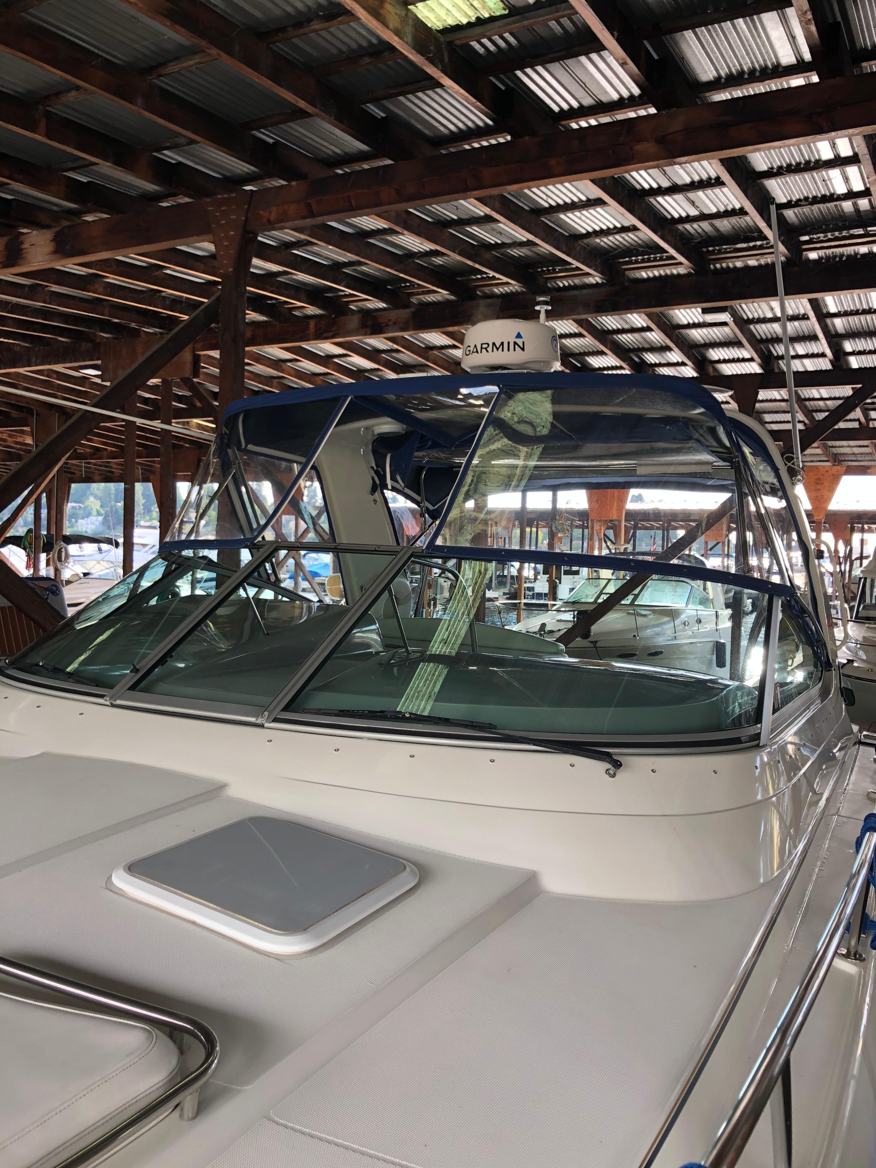 Slide: The Image of 2000 Formula 37 PC yacht docked under covered marina with Garmin radar. - 37