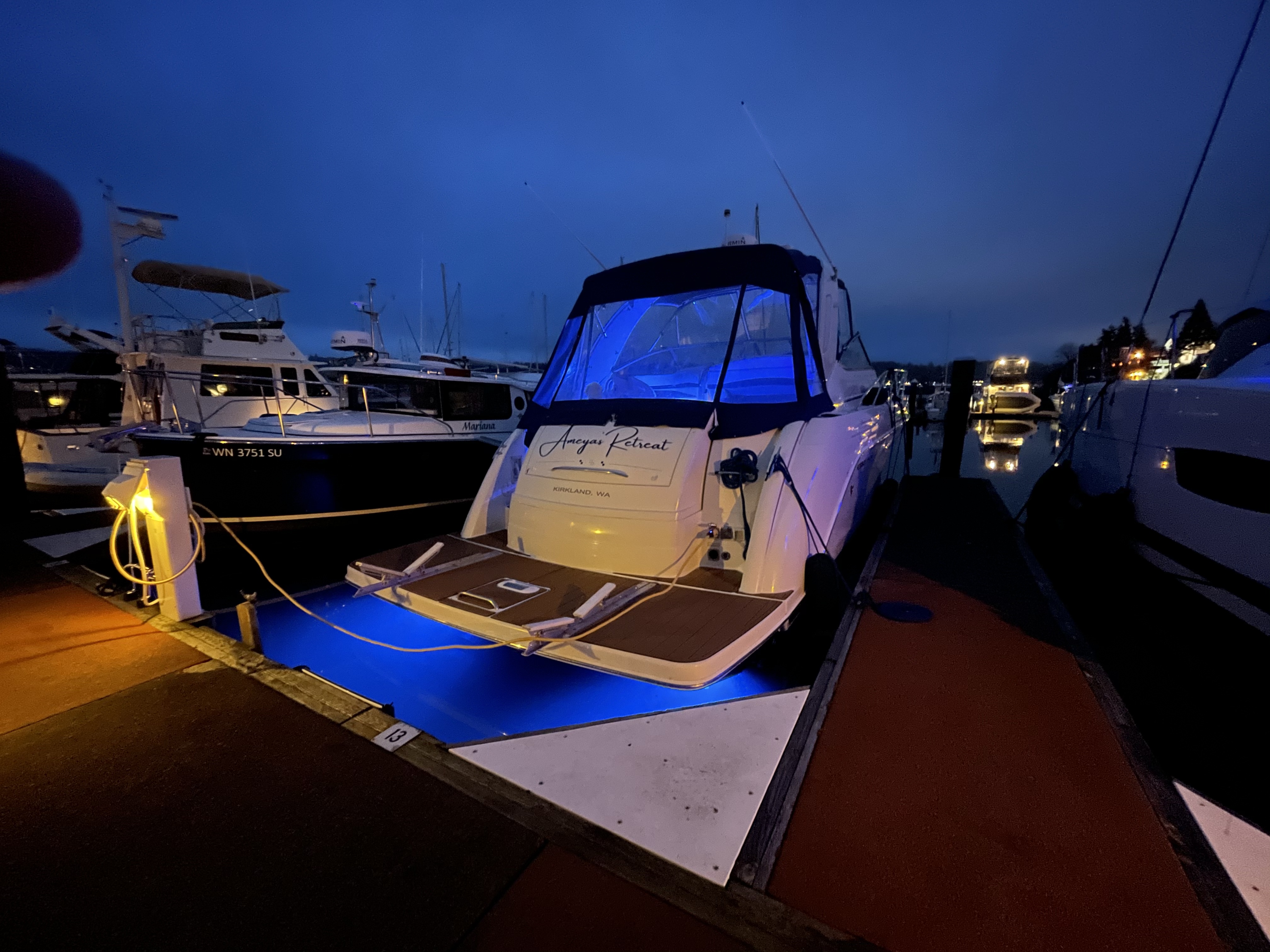 Slide: The Image of 2000 Formula 37 PC yacht docked at marina during evening with blue underwater lights. - 6