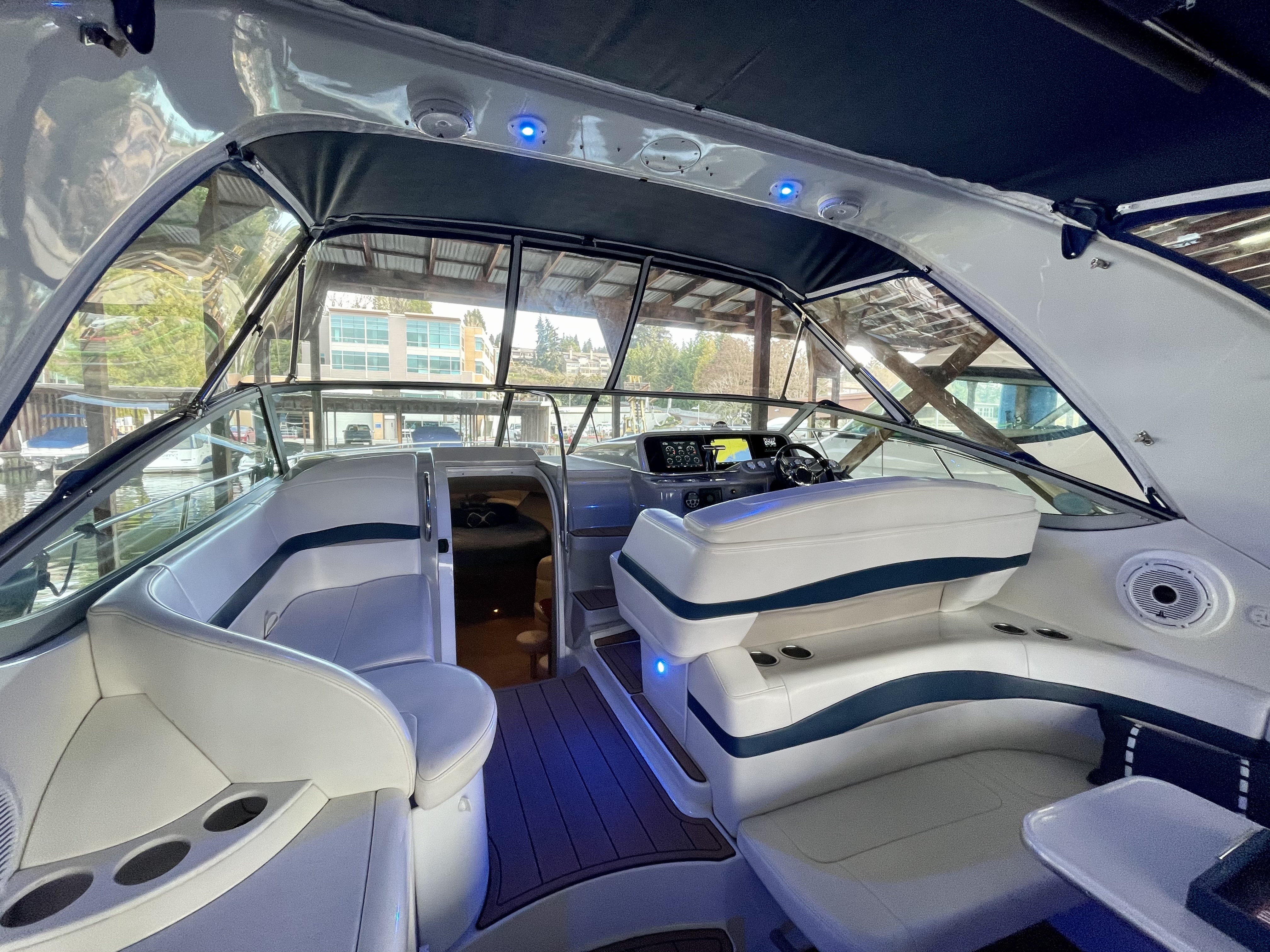 Slide: The Image of Interior of a 2000 Formula 37 PC yacht with modern seating and navigation area. - 7