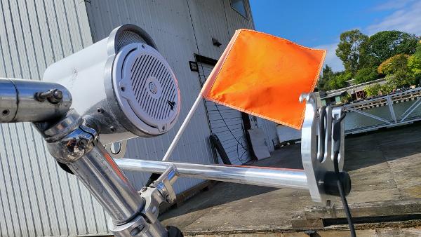 Slide: The Image of Close-up of a 1996 Four Winns 190 Horizon Bowrider with an orange flag and speaker. - 26