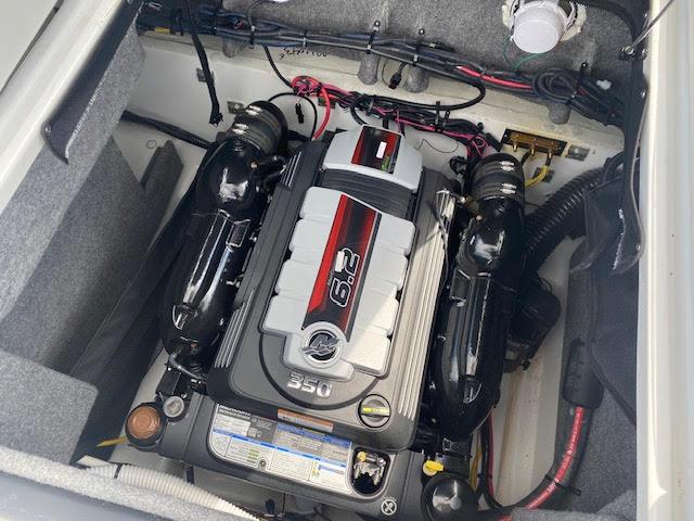 Slide: The Image of 2023 Four Winns H260 boat engine compartment with a 6.2L 350 horsepower engine. - 10