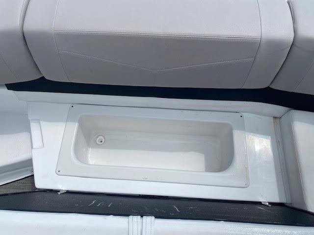 Slide: The Image of Built-in storage compartment on a 2023 Four Winns H260 boat. - 11