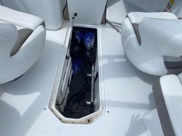 Slide: The Image of Storage compartment on a 2023 Four Winns H260 boat. - 12