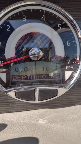 Slide: The Image of Close-up of 2023 Four Winns H260 boat depth gauge and hour meter. - 15