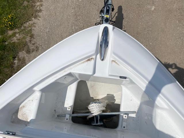 Slide: The Image of 2023 Four Winns H260 boat bow with anchor storage compartment. - 19