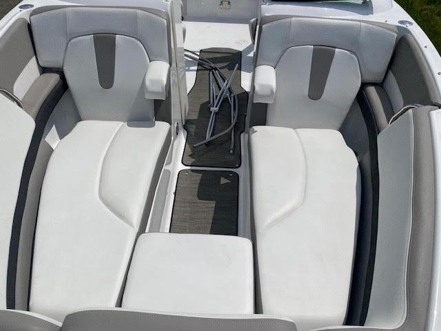 Slide: The Image of 2023 Four Winns H260 boat interior with white and gray seating - 20