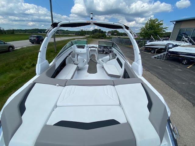 Slide: The Image of 2023 Four Winns H260 boat interior with spacious seating and modern design. - 5
