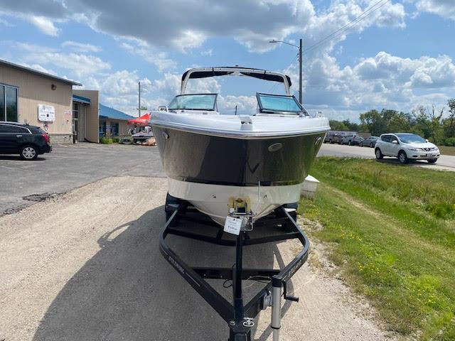 Slide: The Image of 2023 Four Winns H260 boat on trailer in outdoor dealership lot. - 9