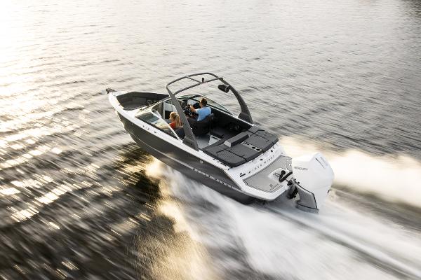 Slide: The Image of 2023 Four Winns H2 OB boat cruising on water. - 2