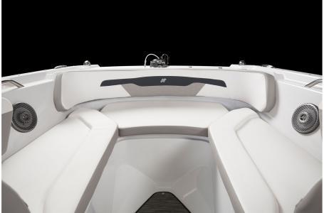Slide: The Image of 2020 Four Winns HD 200 OB boat interior with cushioned seating and speakers. - 18