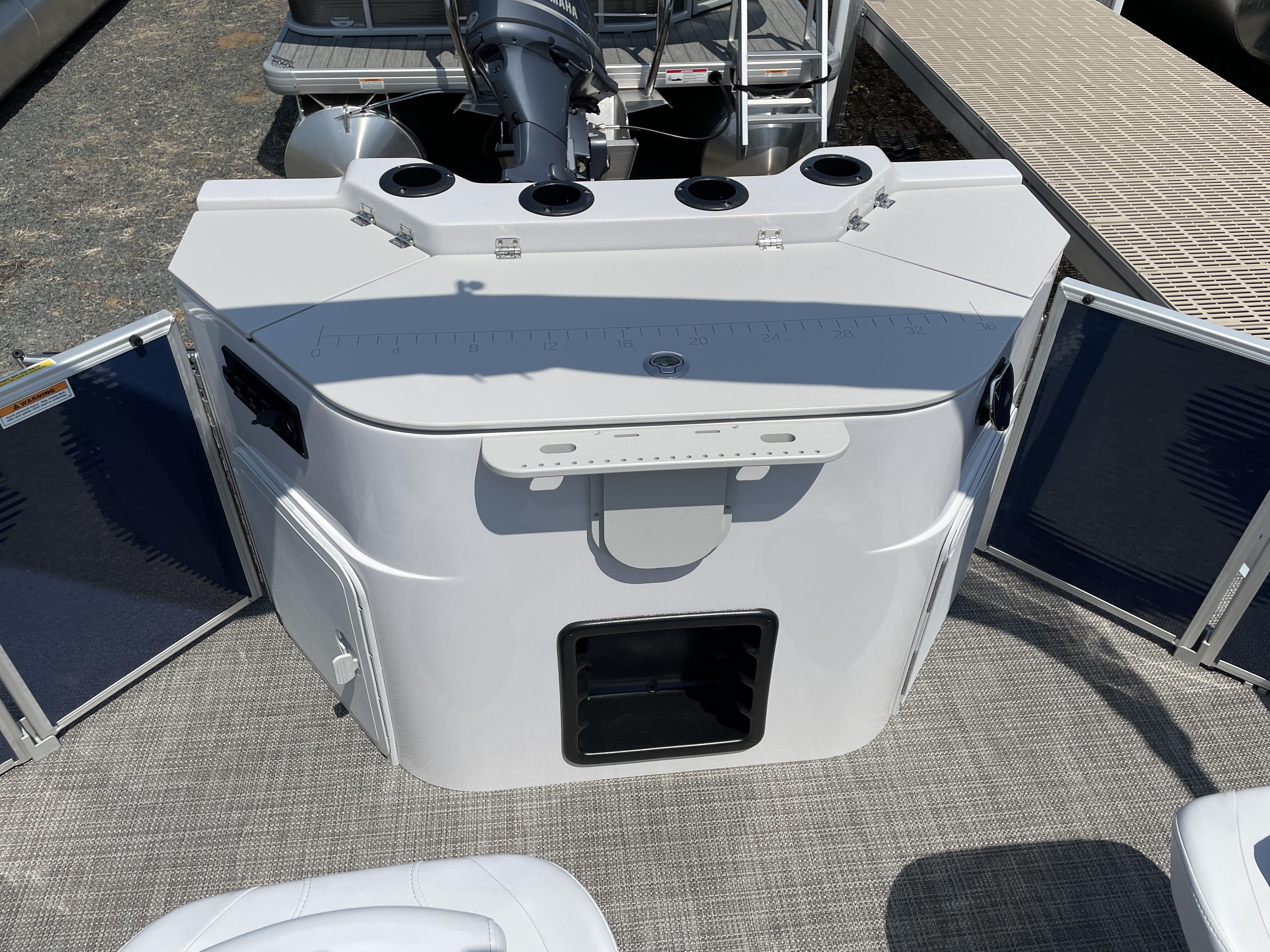 Slide: The Image of 2024 Godfrey SW2186FS boat stern with motor and storage compartments. - 3