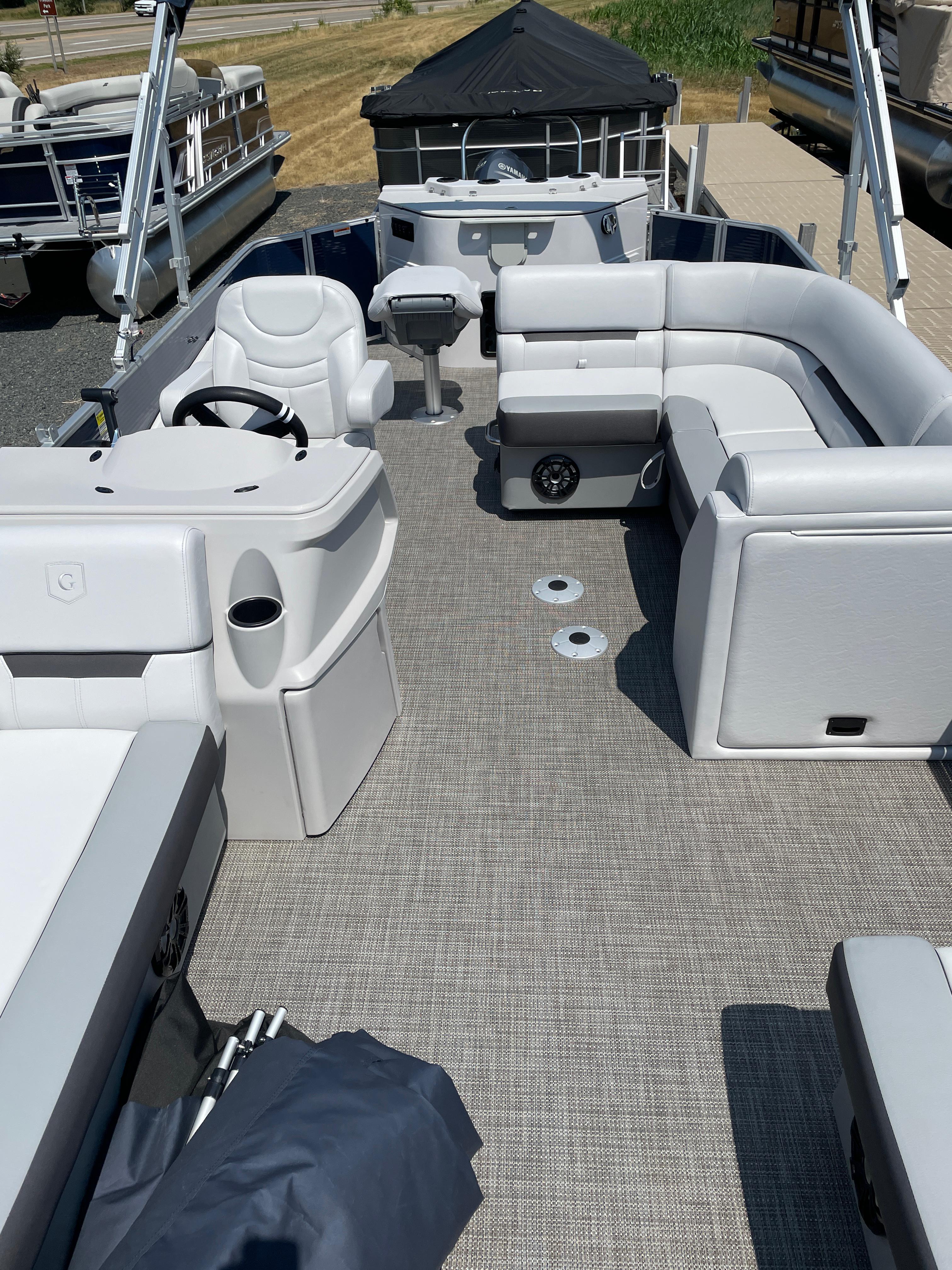 Slide: The Image of 2024 Godfrey SW2186FS pontoon boat interior with seating and steering console. - 5
