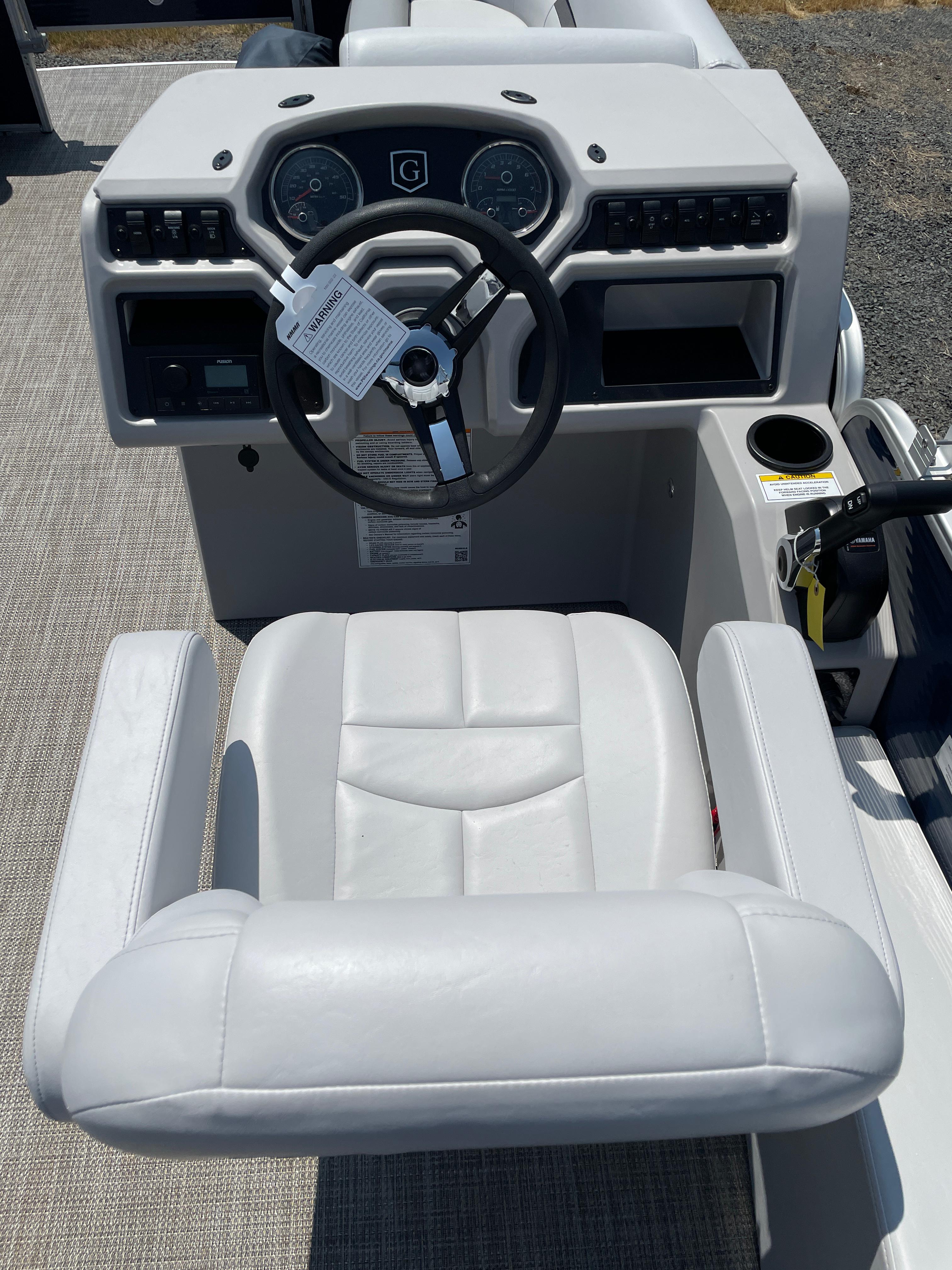 Slide: The Image of Captain's seat and dashboard of a 2024 Godfrey SW2186FS boat. - 7