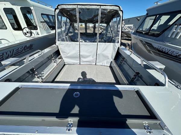 Slide: The Image of 2024 Hewescraft 200 Pro-V boat interior with covered seating area. - 3