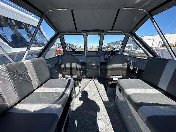 Slide: The Image of 2024 Hewescraft 200 Pro-V boat interior with seating and steering console. - 4