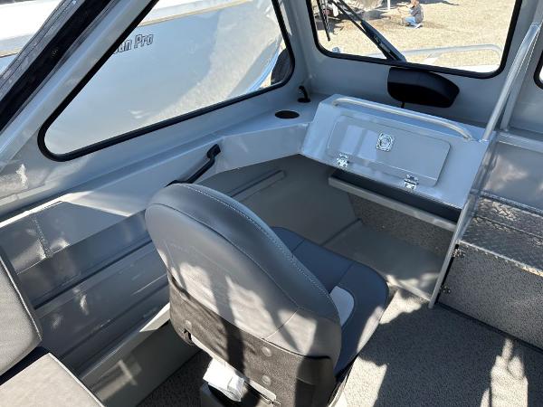 Slide: The Image of Interior of 2024 Hewescraft 200 Pro-V boat with seating and storage compartments. - 6