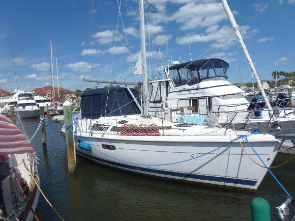 Slide: The Image of 2001 Hunter 420 Passage sailboat docked at a marina on a sunny day. - 1