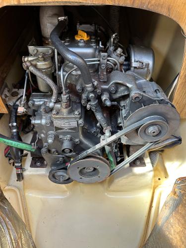 Slide: The Image of 1986 J Boats J30 engine compartment with visible mechanical components. - 11