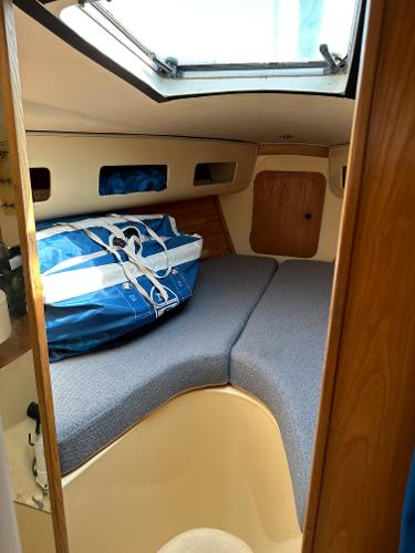 Slide: The Image of 1986 J Boats J30 cabin interior with blue sail bag. - 13
