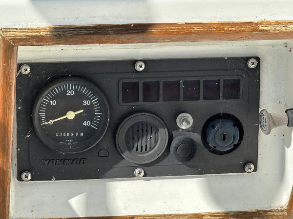 Slide: The Image of 1986 J Boats J30 Yanmar engine control panel with RPM gauge. - 15