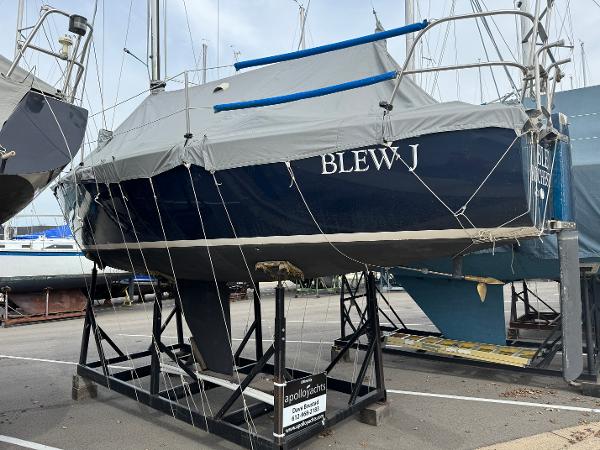 Slide: The Image of 1986 J Boats J30 sailboat Blew J on a cradle in a boatyard. - 16
