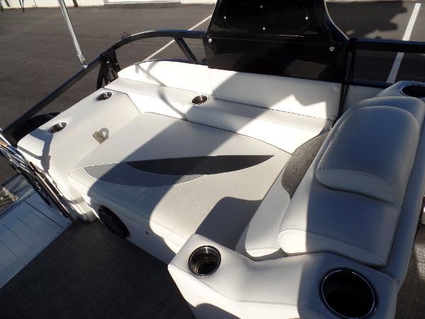 Slide: The Image of 2017 JC Sporttoon 28TT boat with white cushioned seating and cup holders. - 19
