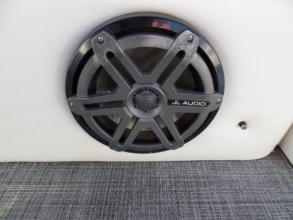 Slide: The Image of JL Audio speaker on 2017 JC Sporttoon 28TT boat, close-up view. - 24