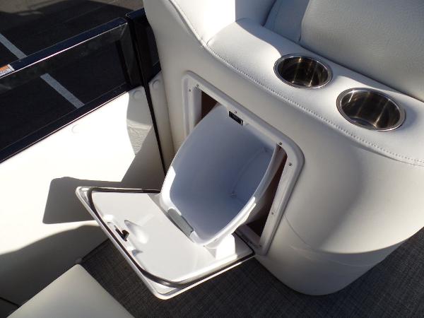 Slide: The Image of 2017 JC Sporttoon 28TT boat interior with built-in trash bin and cup holders. - 25