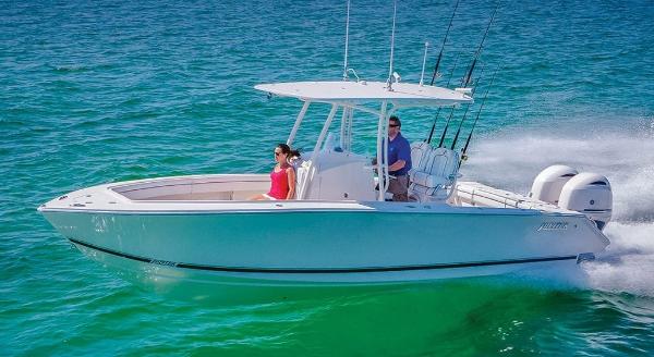 Slide: The Image of 2025 Jupiter 26 FS boat cruising on clear blue water. - 9