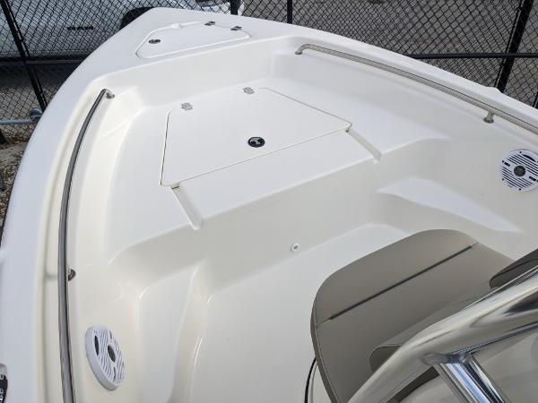 Slide: The Image of 2024 Key West 189 FS boat bow area with storage compartments and seating. - 9